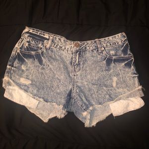 Acid wash denim shorts with exposed pockets